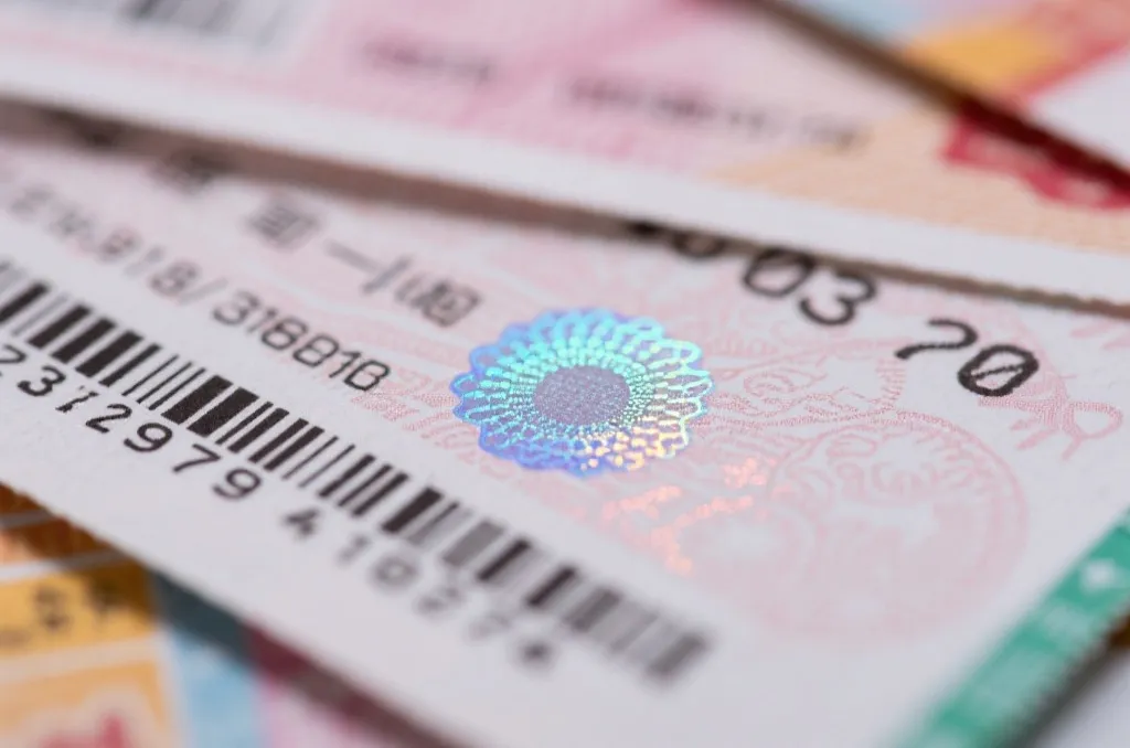 防伪彩票票据细节特写,展示防伪码与涂层